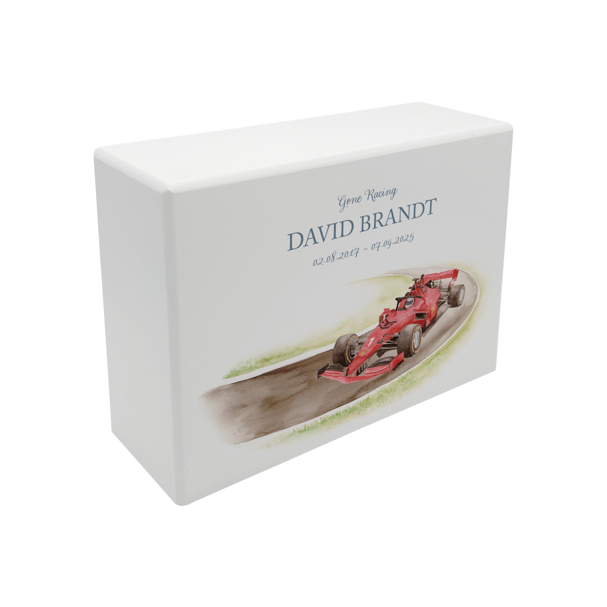 A beautifully crafted solid wooden urn, finished in white with a soft watercolour design of a Race F1 Race car  on a track, perfect for Dad, Thoughtfully made for either display or burial, this personalised urn can be customised to create a meaningful memorial. Perfect for holding ashes of a loved one or a beloved pet, it serves as a comforting tribute and keepsake.