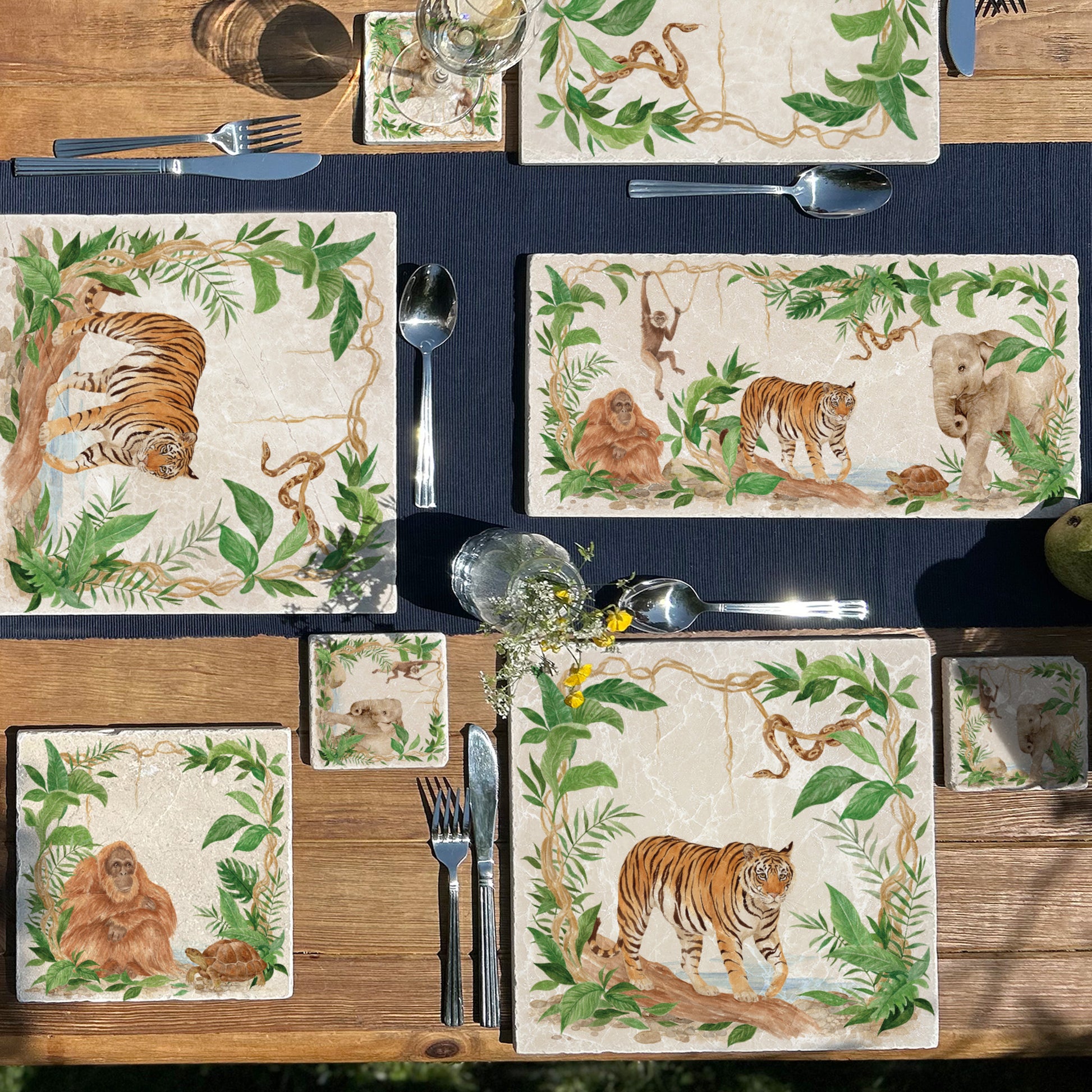 Welcoming our Rainforest Design, surrounded by the rainforest leaves and vines. Capture our Tiger and Python , Orangutan and Tortoise, Elephant and Gibbon quietly prowling through the Rainforest, Illustrated in our  original watercolour designs on Sharing Serving Large Placemat, Coaster and Medium worktop protector  Platter.