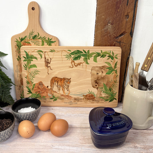 Rainforest design featuring an elephant, Tiger, gibbon, snake, orangutan and tortoise. perfect chopping board gift. 