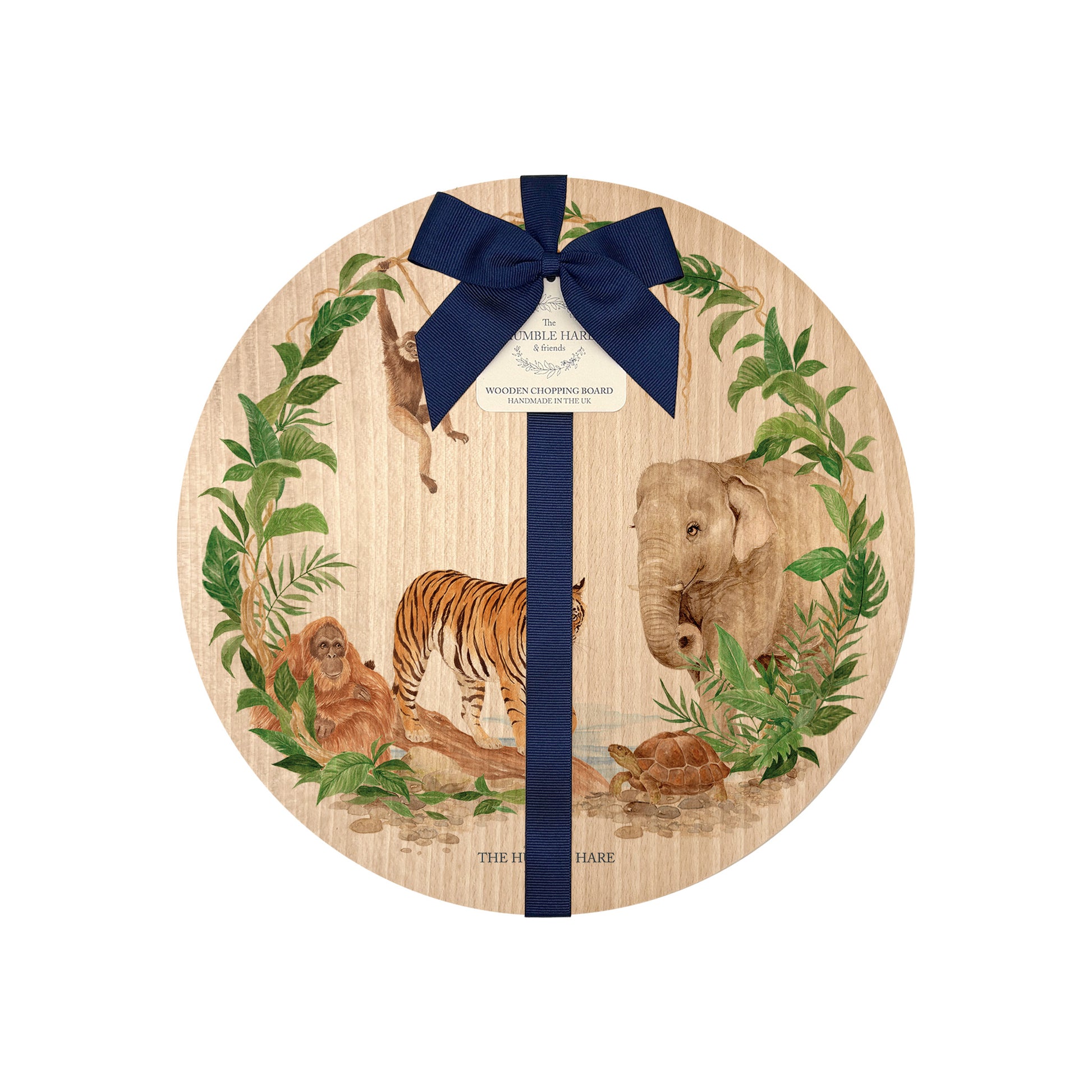 Round beech wood chopping board featuring a watercolour design of rainforest animals in the jungle. The wooden board is finished with a blue gift ribbon and tag.