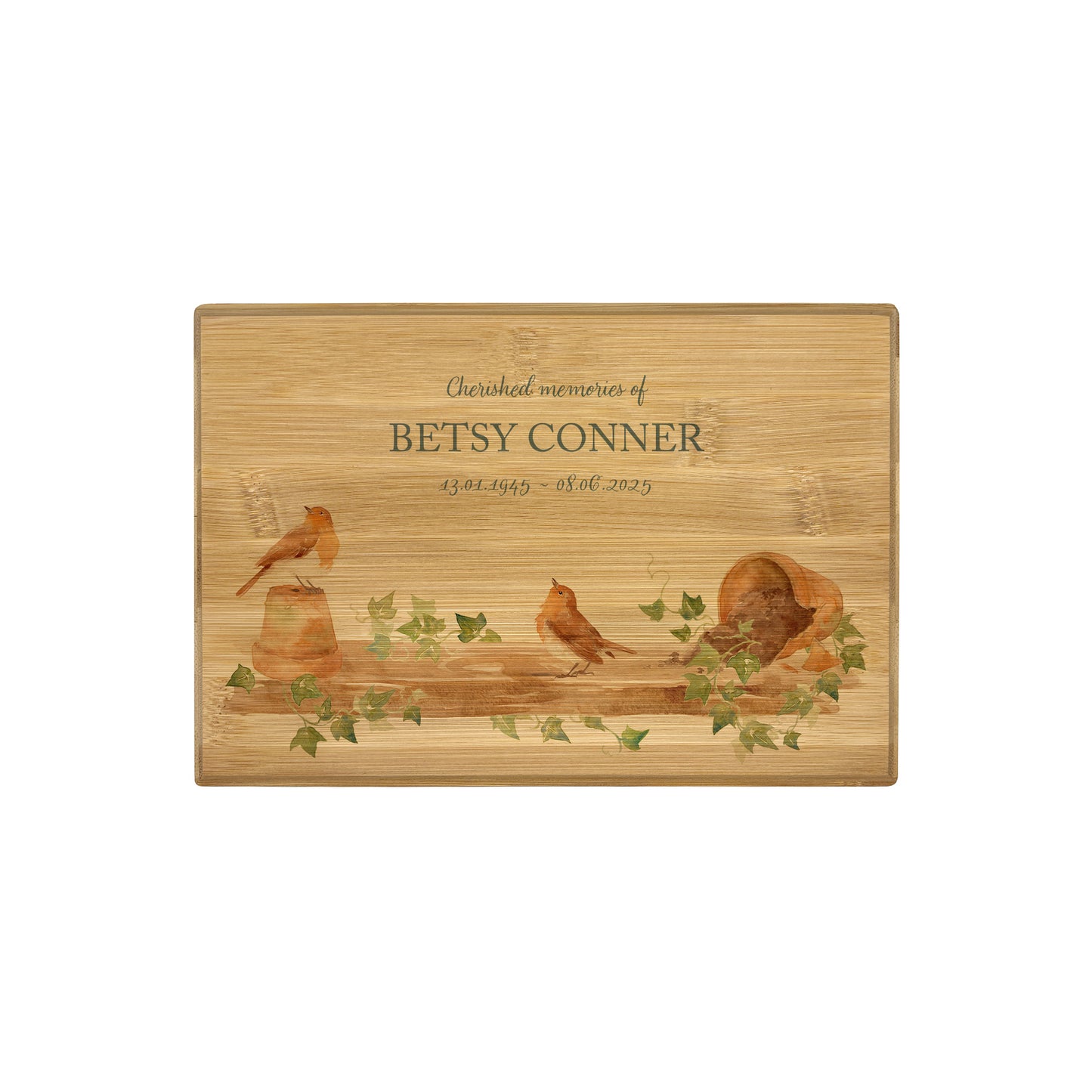A beautifully crafted solid Bamboo wooden urn, personalised and finished with a soft watercolour design of Robins on a shelf sat on pots, when Robins appear a loved one is near. Thoughtfully made for either display or burial, this personalised urn can be customised to create a meaningful memorial. Perfect for holding ashes of a loved one or a beloved pet, it serves as a comforting tribute and keepsake. 