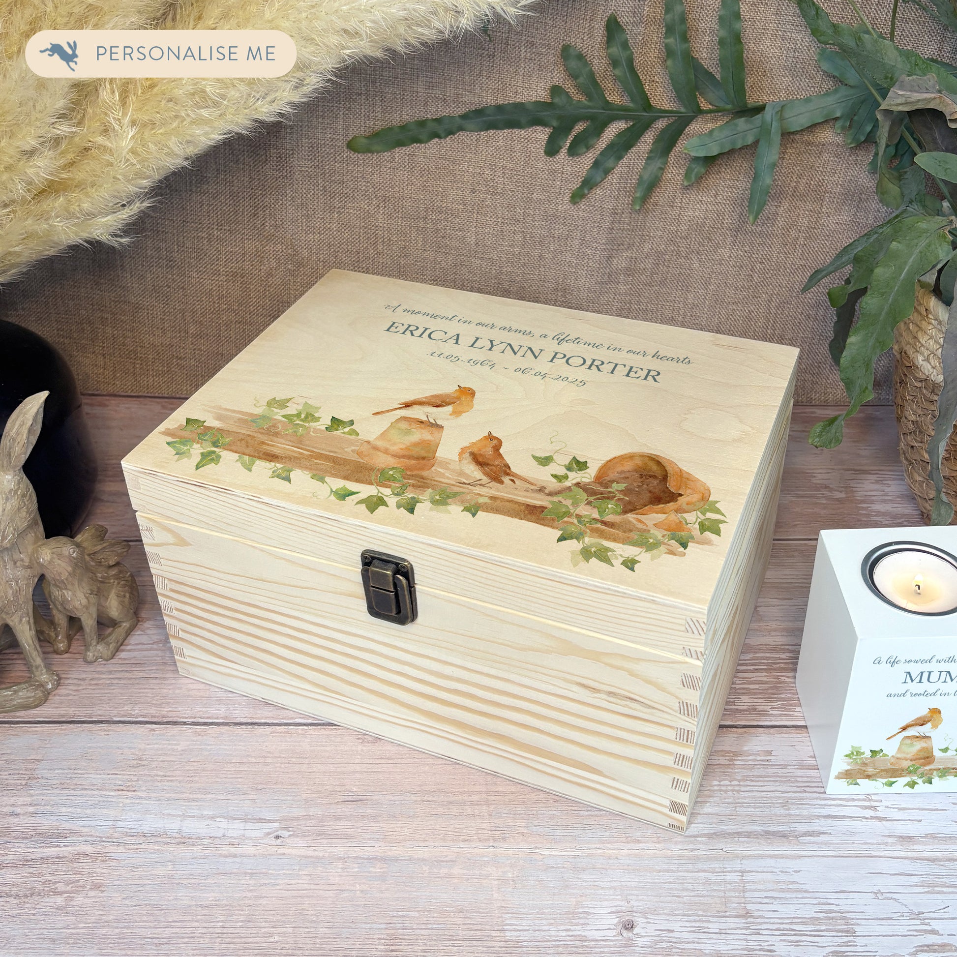 Wooden box with a decorative lid featuring animal illustrations on a wooden background. Perfect funeral memory keepsake box, for storing ashes, order of service, flowers, pictures. 