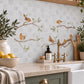 Countryside landscape marble mural creating a statement kitchen feature, Robins on Branches. Watercolour animals on wall tiles. 