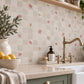 Watercolour roses and rose hips shown across individual mosaic pieces.