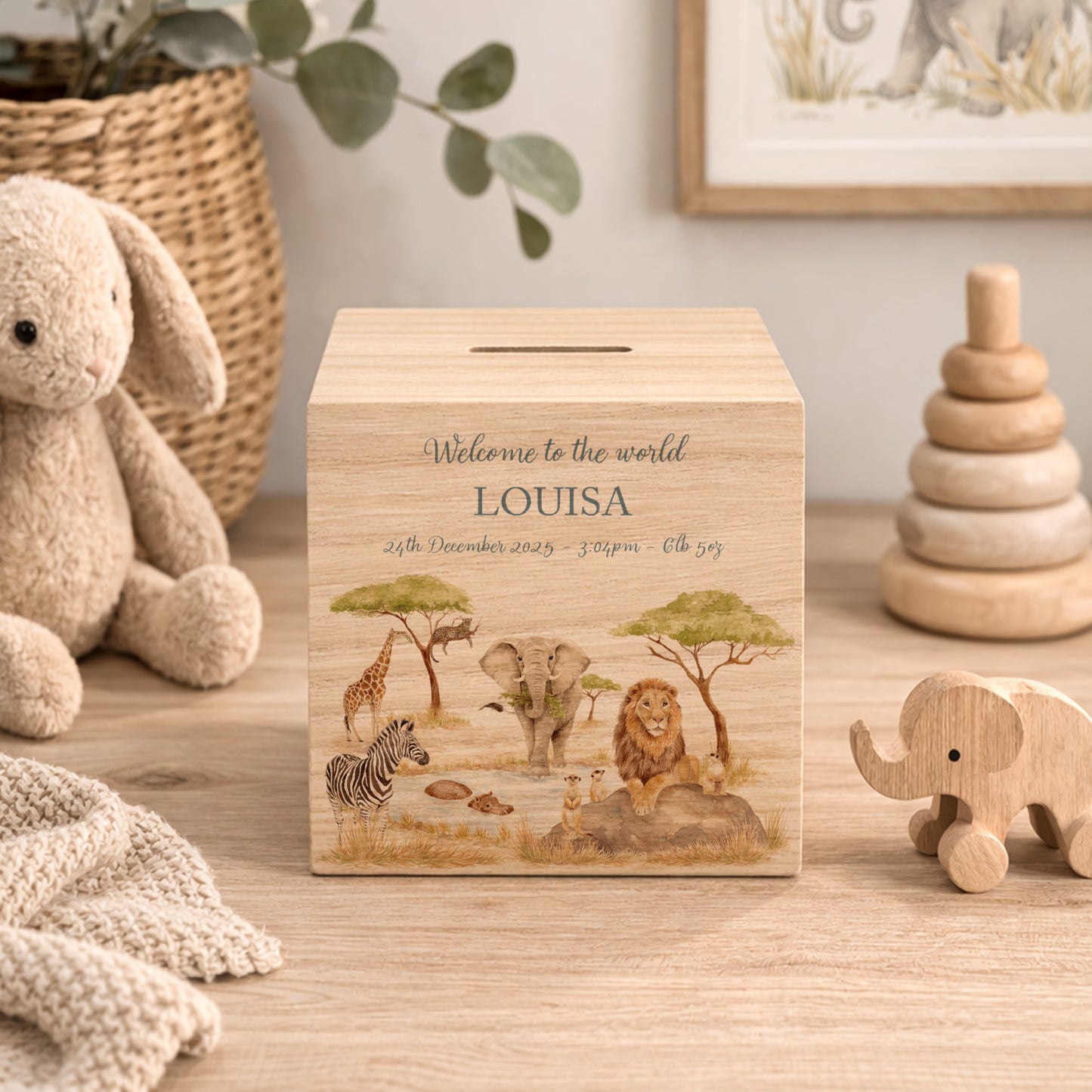 handmade baby money box with watercolour illustration in neutral nursery unique personalised gift with Animals from the savannah all gathered around the watering hole. 
