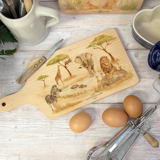 Savannah animals gathering around the watering hole on our flip chopping boards. 