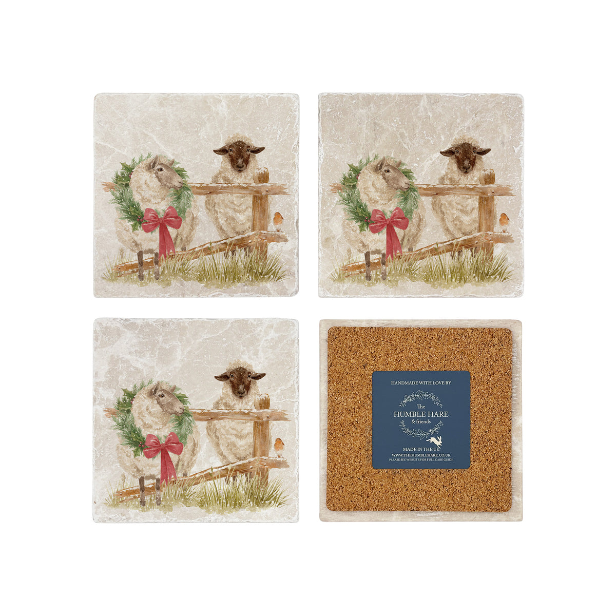 A set of four square marble coasters with a watercolour illustration of a farmyard scene, with sheep in the snow wearing a Christmas wreath. One coaster is flipped to show that the back is covered with cork.