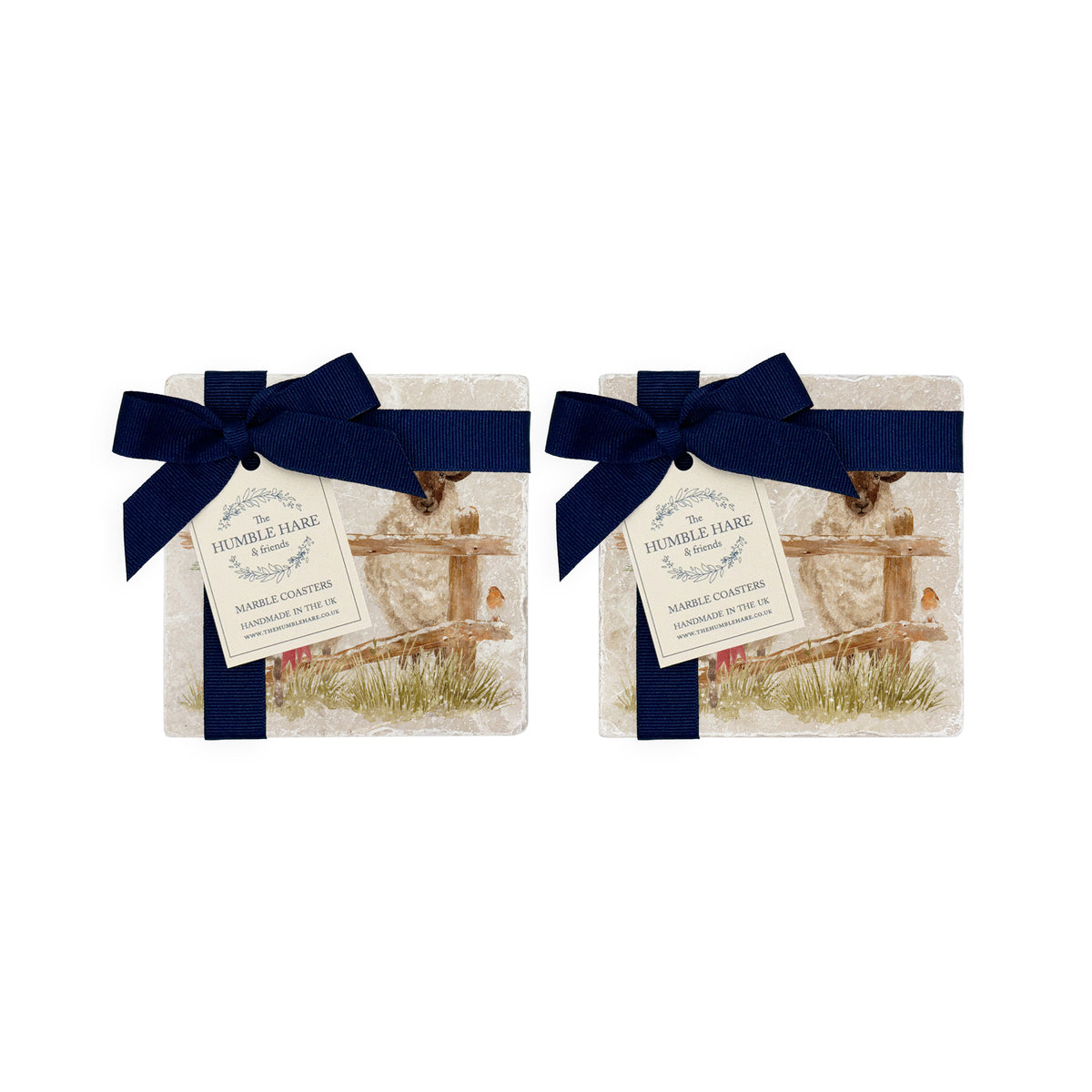 A set of four square marble coasters with a watercolour illustration of a farmyard scene, with sheep in the snow wearing a Christmas wreath. The coasters are bowed in two pairs with a navy blue ribbon.