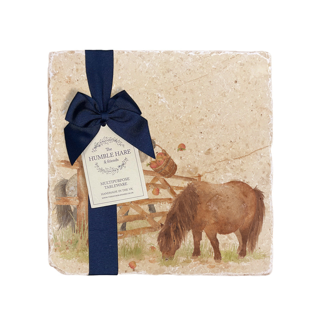A medium multipurpose marble platter with a watercolour Shetland pony design, packaged with a luxurious dark blue bow and branded gift tag.