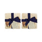 A set of 4 handmade marble coasters featuring a watercolour Shetland pony design, packaged in 2 pairs, with a luxurious blue bow and gift tag.