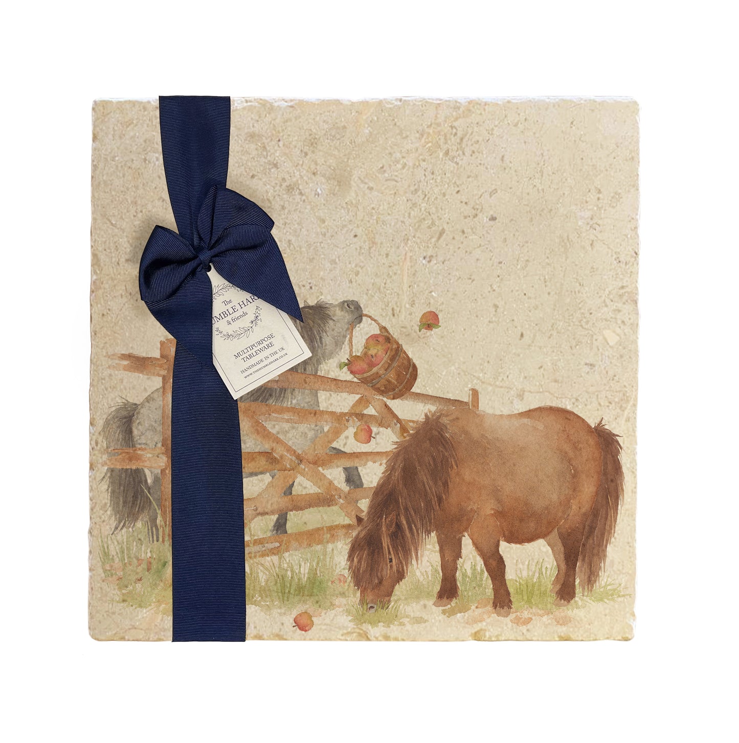 A multipurpose marble platter with a watercolour Shetland pony design, packaged with a luxurious dark blue bow and branded gift tag.