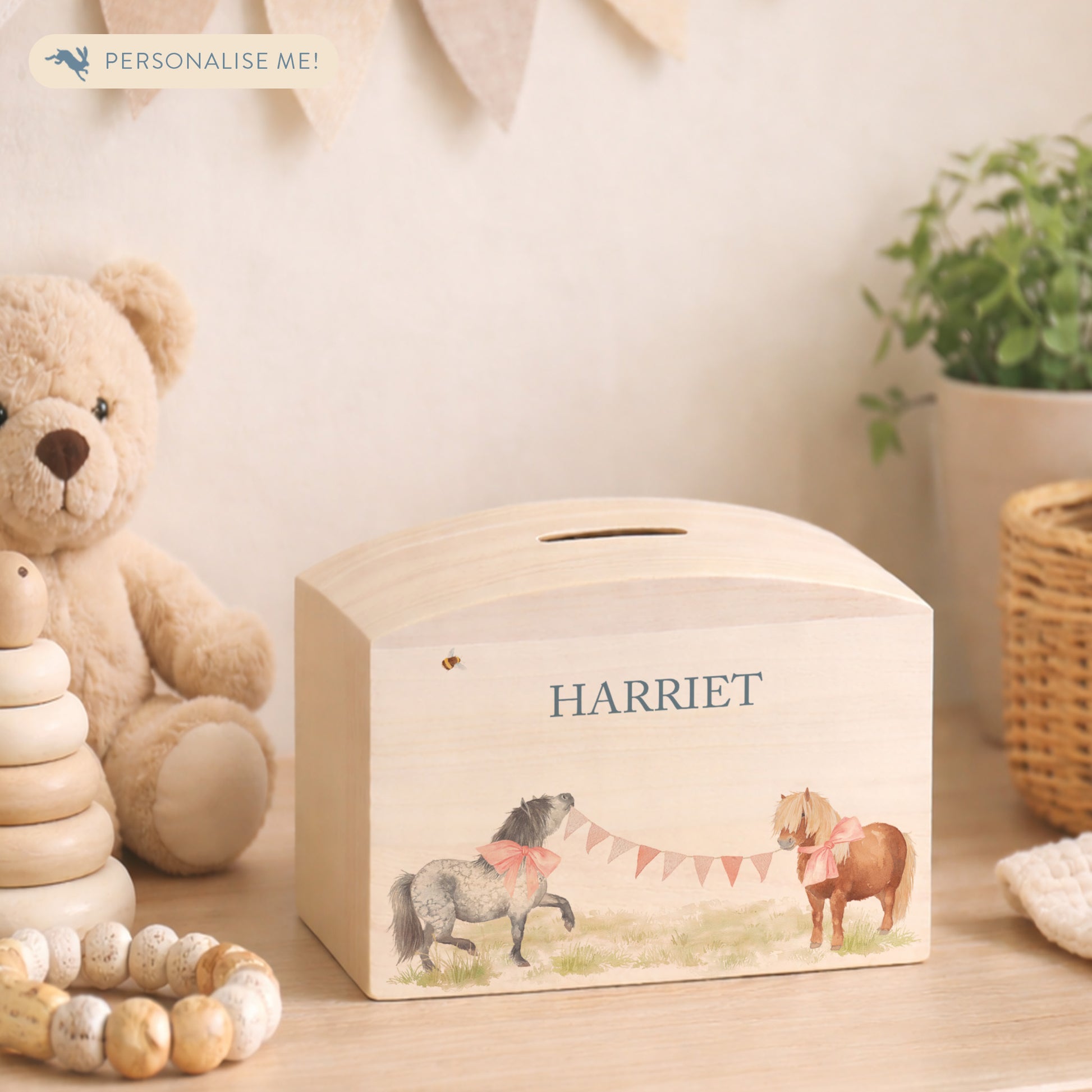 wooden handmade money box with watercolour artwork in childrens bedroom