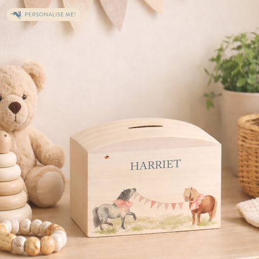wooden handmade money box with watercolour artwork in childrens bedroom