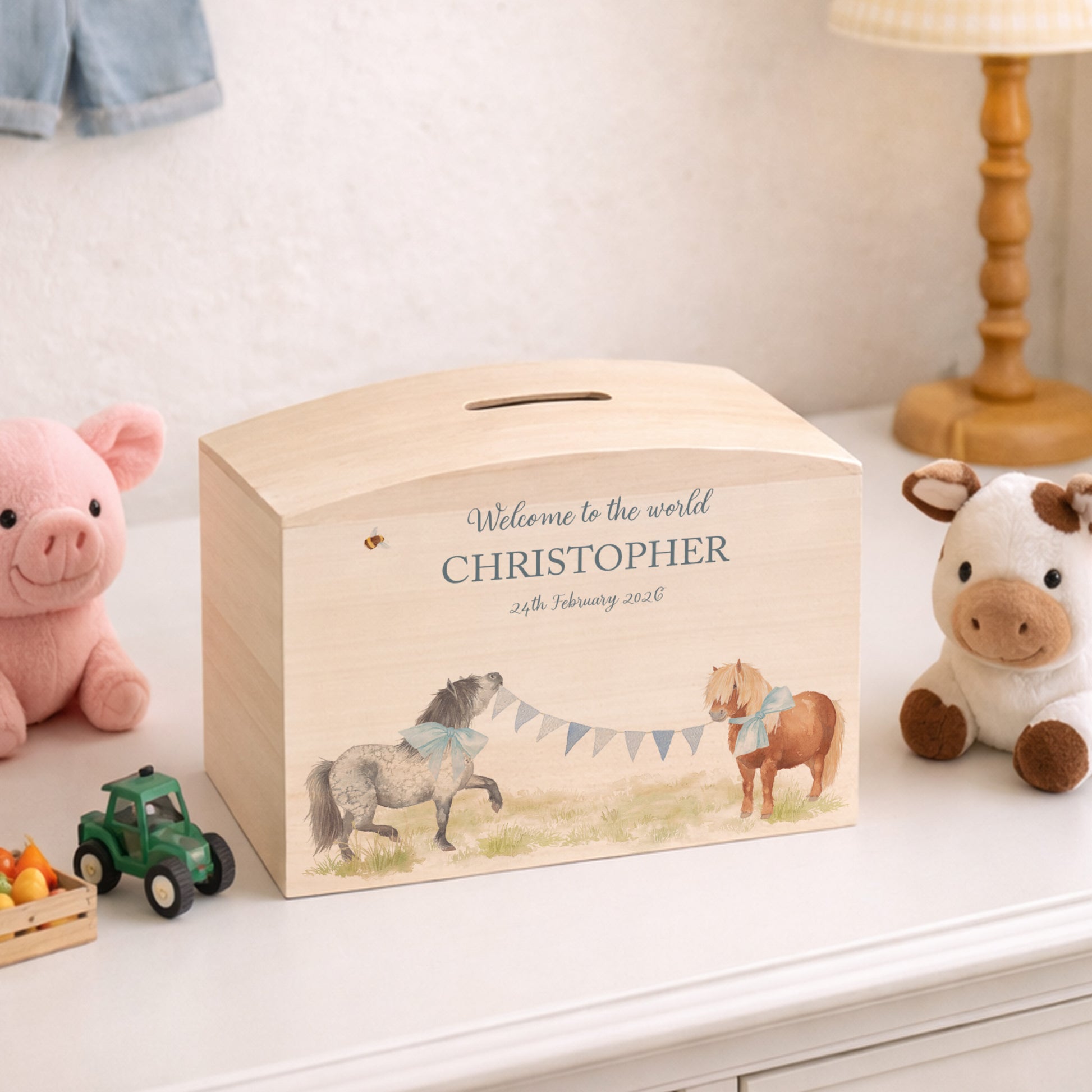 wooden handmade money box with watercolour artwork in childrens bedroom