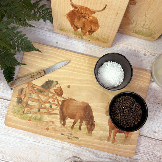 Shetlands playing in the field, featuring on our wooden chopping boards 