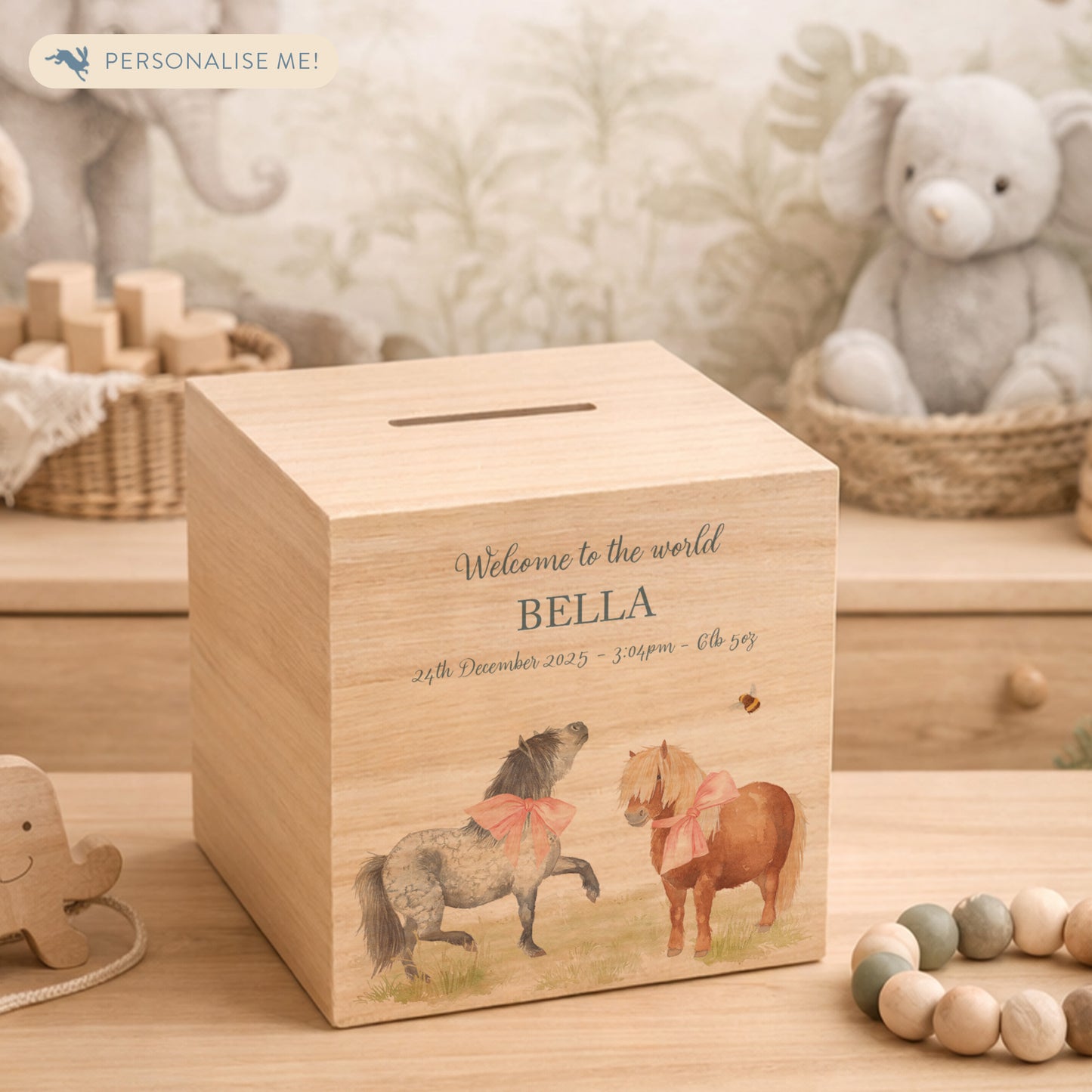 personalised handmade wooden money box for christening nursery decor, Shetland ponies playing with bunting and bows around their neck. 
