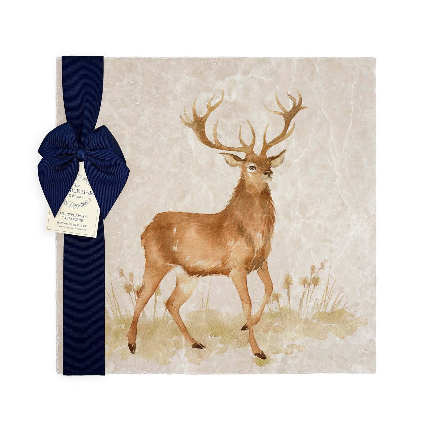 A square medium marble platter featuring a majestic stag in a watercolour style, packaged with a luxurious blue bow and gift tag.