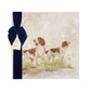 A square large marble platter featuring a watercolour design of two working spaniel dogs. The platter is packaged with a luxurious blue gift bow.