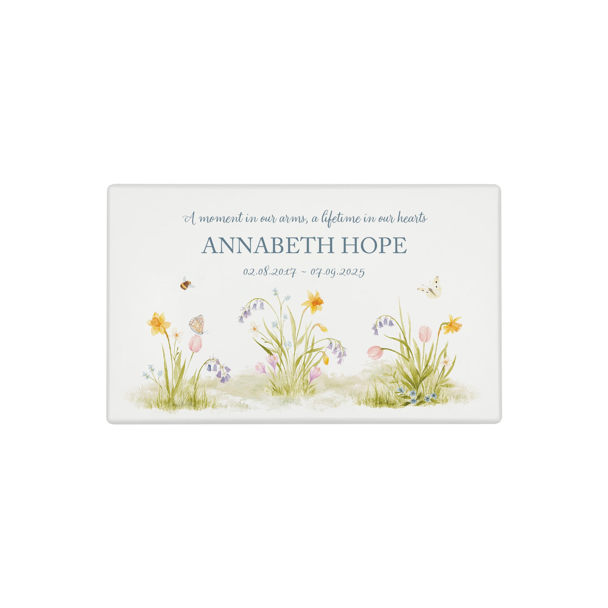A beautifully crafted solid wooden urn, finished in white with a soft watercolour design of a Spring Garden with Bees and Butterflies, Thoughtfully made for either display or burial, this personalised urn can be customised to create a meaningful memorial. Perfect for holding ashes of a loved one or a beloved pet, it serves as a comforting tribute and keepsake.