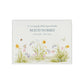 A beautifully crafted solid wooden urn, finished in white with a soft watercolour design with Spring flowers, Bees and Butterflies,. Thoughtfully made for either display or burial, this personalised urn can be customised to create a meaningful memorial. Perfect for holding ashes of a loved one or a beloved pet, it serves as a comforting tribute and keepsake.