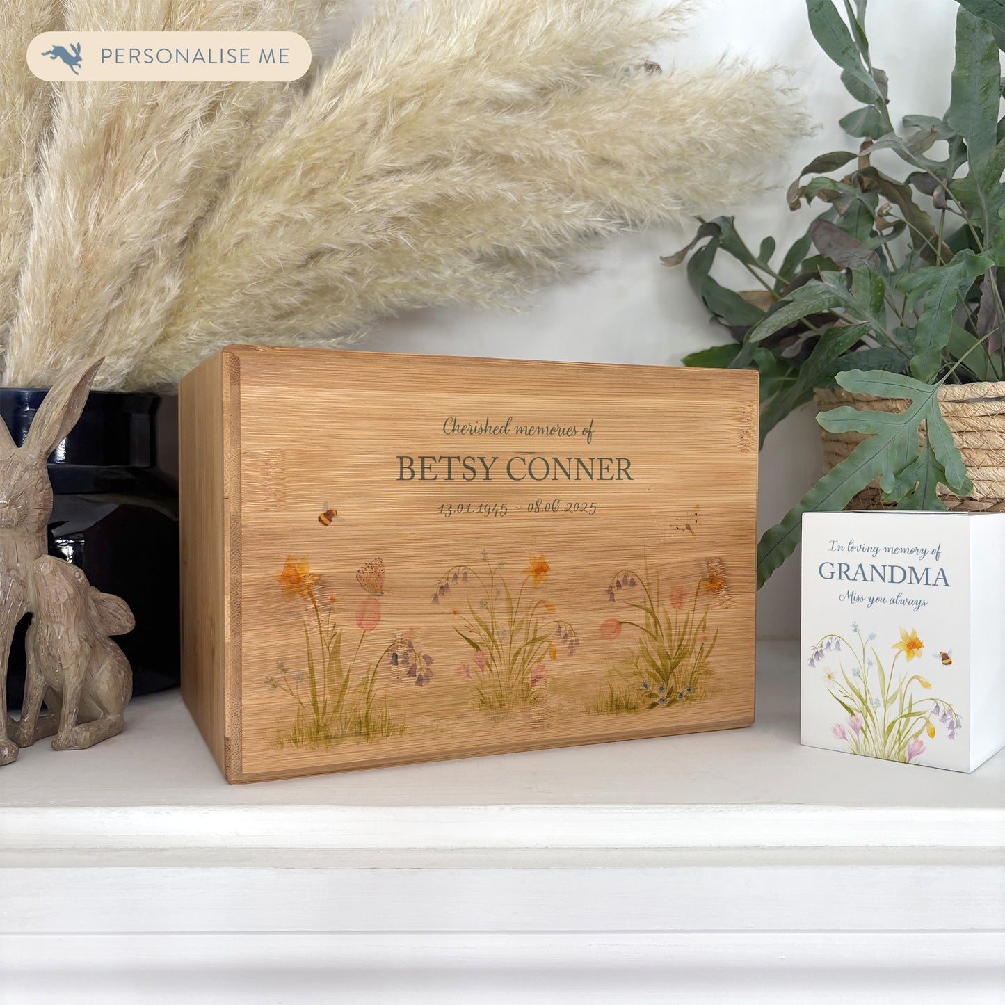 A beautifully crafted solid Bamboo wooden urn, personalised and finished with a soft watercolour design of Spring Flowers for the person who loved flowers and being in the Garden. Thoughtfully made for either display or burial, this personalised urn can be customised to create a meaningful memorial. Perfect for holding ashes of a loved one or a beloved pet, it serves as a comforting tribute and keepsake. 