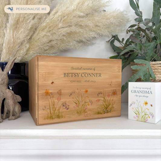 A beautifully crafted solid Bamboo wooden urn, personalised and finished with a soft watercolour design of Spring Flowers for the person who loved flowers and being in the Garden. Thoughtfully made for either display or burial, this personalised urn can be customised to create a meaningful memorial. Perfect for holding ashes of a loved one or a beloved pet, it serves as a comforting tribute and keepsake. 