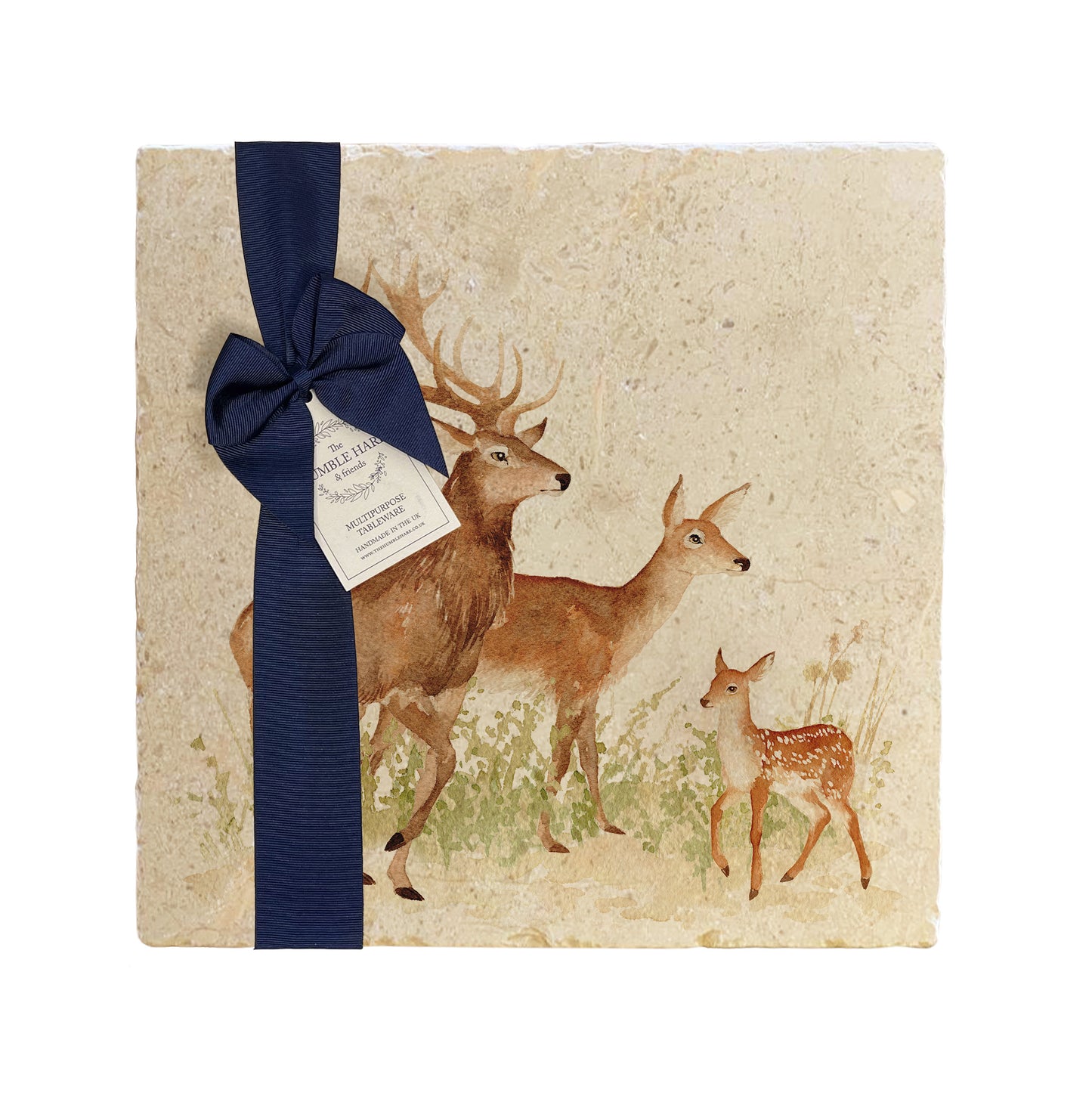 A multipurpose marble platter with a watercolour design featuring a family of red deer, packaged with a luxurious dark blue bow and branded gift tag.