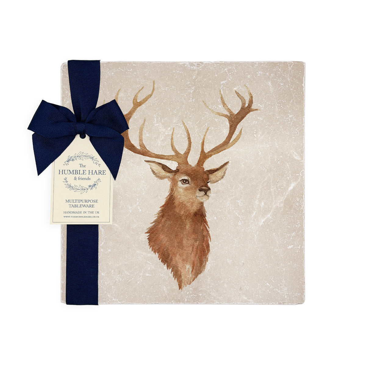 A square medium marble platter featuring a watercolour portrait of a majestic stag. The platter is packaged with a navy blue bow and paper tag.