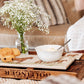 A rectangular marble sharing platter, featuring a watercolour design of three rare breed Suffolk Punch horses in a field.