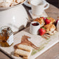 A rectangular marble sharing platter, featuring a watercolour design of three rare breed Suffolk Punch horses in a field.