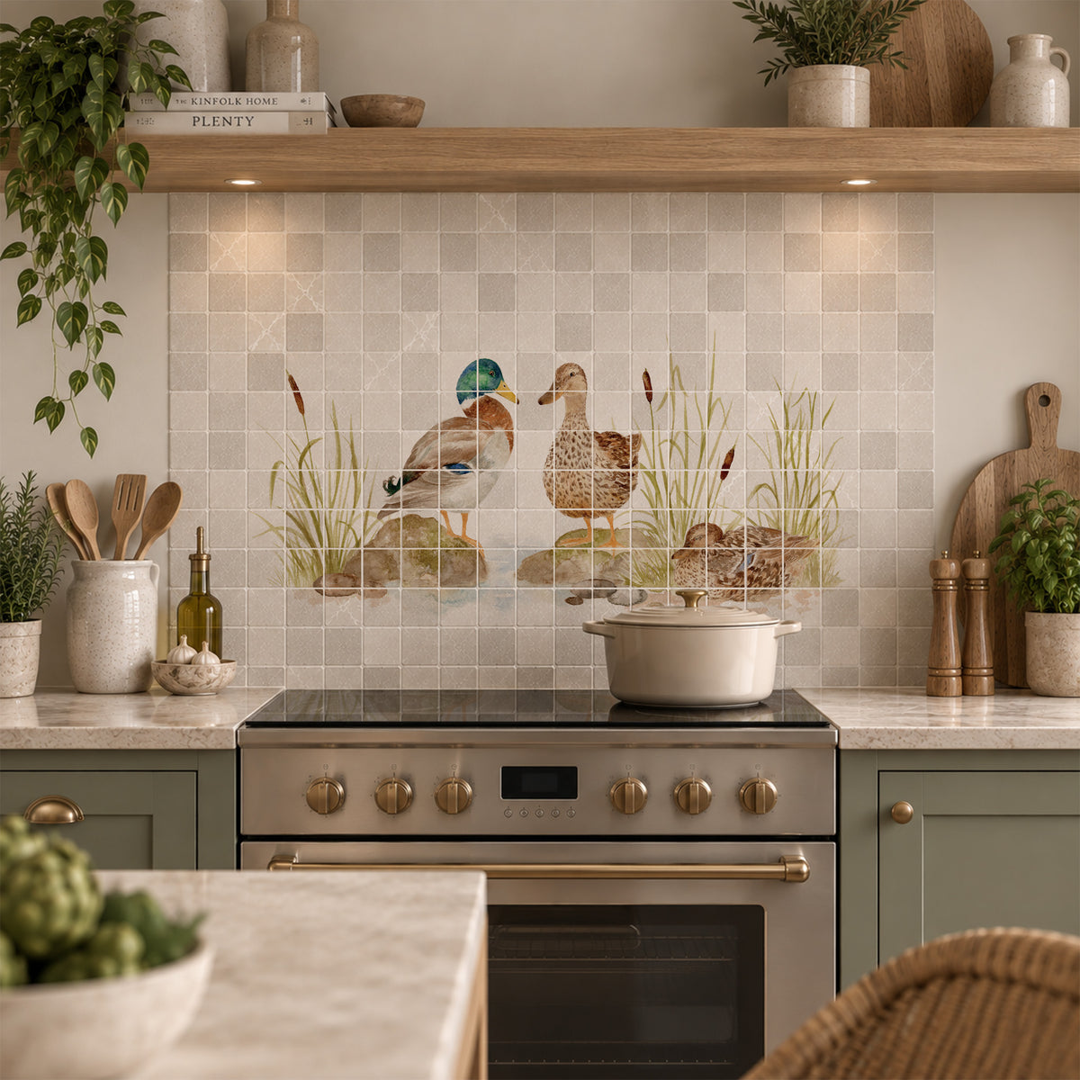 A kitchen backsplash featuring square beige tiles with a central printed or installed mural of two ducks standing in reeds 