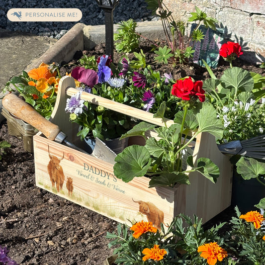 wooden luxury Trug/Caddy the perfect personalised gift. Each product is lovingly designed, handmade with our Countryside inspired watercolour designs. This design features a Highland cow set in a flower bed unique designs for a truly one off special occasion for a loved one. 