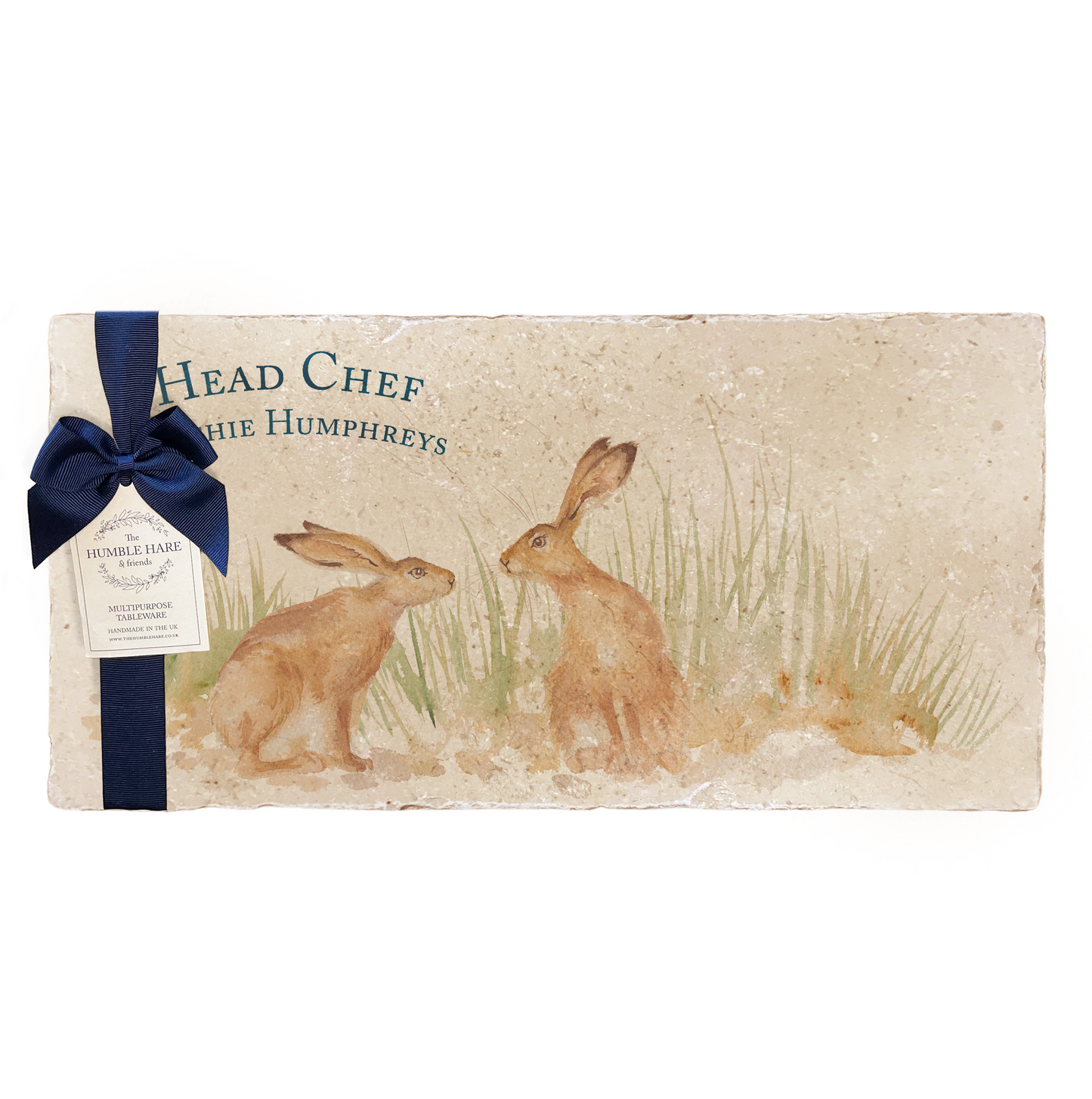 A personalised marble sharing platter featuring two kissing hares in a watercolour style, packaged with a luxurious dark blue bow and branded gift tag.