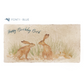 A personalised rectangular marble sharing platter featuring two kissing hares in a watercolour style. The example personalised dark blue text reads ‘Happy Birthday Beth’ in a brush script font.