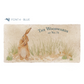 A personalised rectangular marble sharing platter featuring a hare washing his ear in a watercolour style. The example personalised dark blue text reads ‘The Woodwards at No. 75’ in a classic serif font.