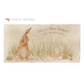 A personalised rectangular marble sharing platter featuring a hare washing his ear in a watercolour style. The example personalised neutral colour text reads ‘Mr & Mrs Berry, 4th August 2023’ in a classic serif font.