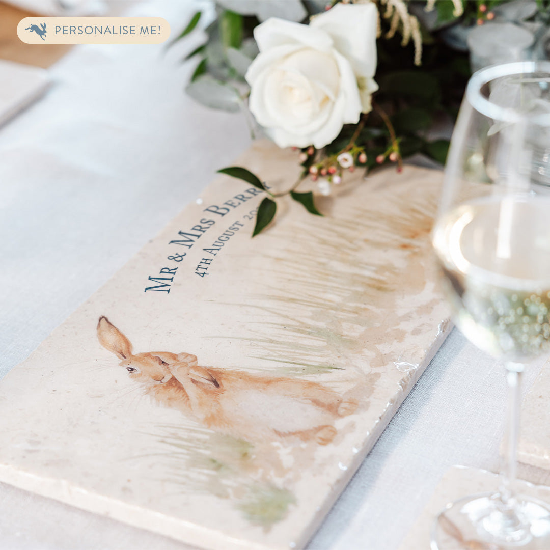 A marble sharing platter set on a table decorated for a wedding. The personalised text reads 'Mr & Mrs Berry' with the wedding date underneath.