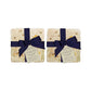 A set of 4 handmade marble coasters with a bee design, packaged in 2 pairs, with a luxurious dark blue bow and gift tag.