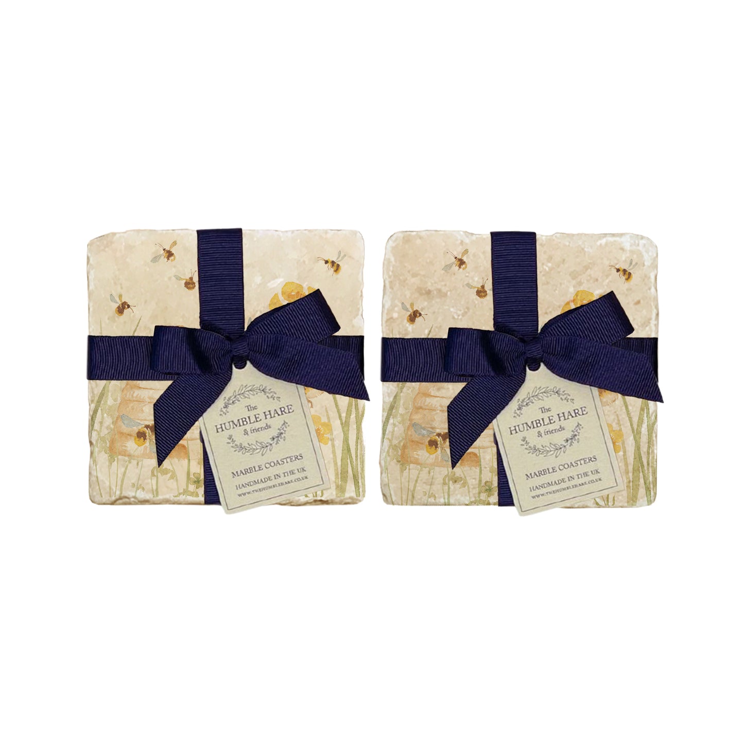 A set of 4 handmade marble coasters with a bee design, packaged in 2 pairs, with a luxurious dark blue bow and gift tag.