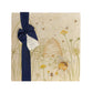 A multipurpose marble platter with a watercolour design featuring bees and a beehive in a buttercup meadow, packaged with a luxurious dark blue bow and branded gift tag.