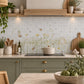 Mosaic tiles featuring a delicate watercolour-style illustration of wildflowers, bees, and a beehive on a white and light grey tile grid background.