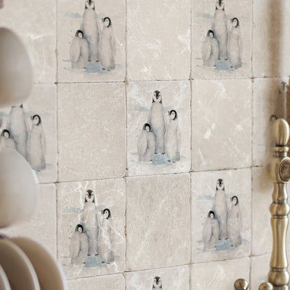 This snowy Design features emperor penguins huddled close together.  