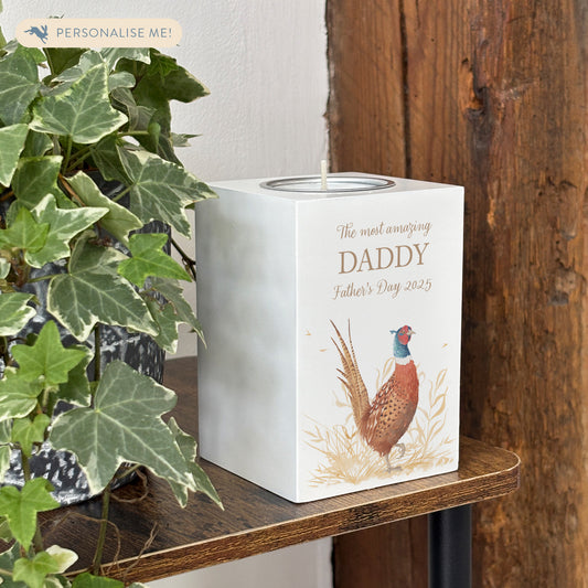 wooden cuboid luxury tealight holder with gorgeous personalised options . Each product is lovingly designed, handmade with our Countryside inspired watercolour designs. This design features a vibrant male pheasant and a farmers crop field. unique designs for a truly one off special occasion for a loved one. 