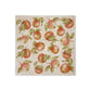 A sunny dinner table set with handmade marble platters featuring a watercolour pattern inspired by English apple orchards.