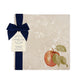 A garden table set with marble placemats and coasters that feature a watercolour apple design.