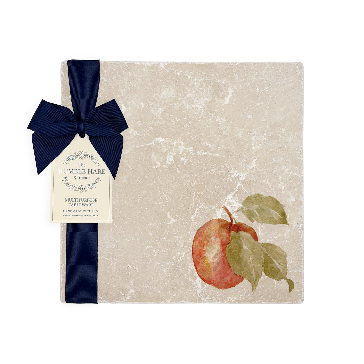 A garden table set with marble placemats and coasters that feature a watercolour apple design.