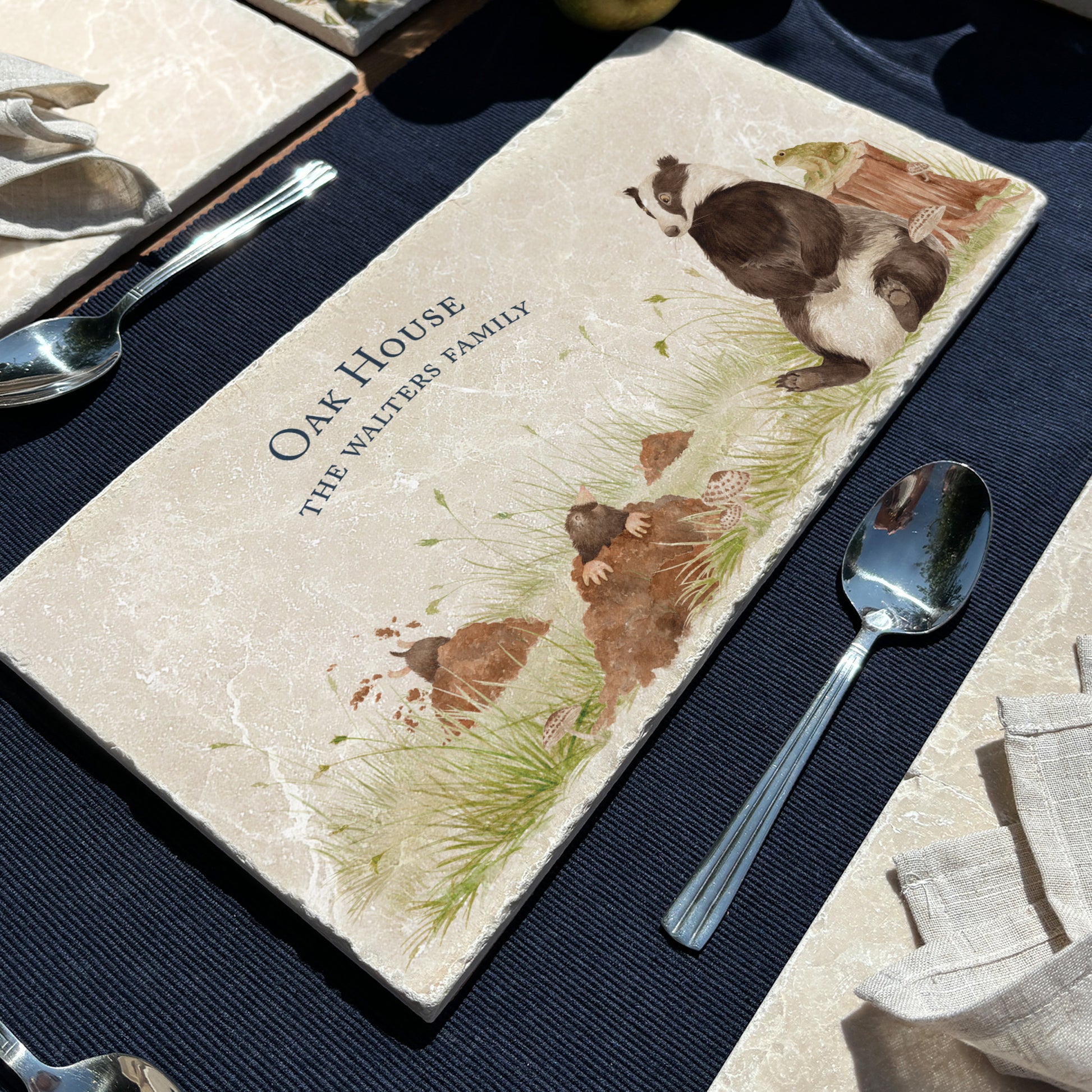 A personalised marble sharing platter with a badger and mole countryside watercolour design. Create a personalised serving platter, trivet or cheeseboard as a luxury gift.
