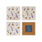 A set of 4 handmade marble coasters, featuring a watercolour bees and lavender flower pattern. One coaster is flipped to show that the coasters are backed with cork.