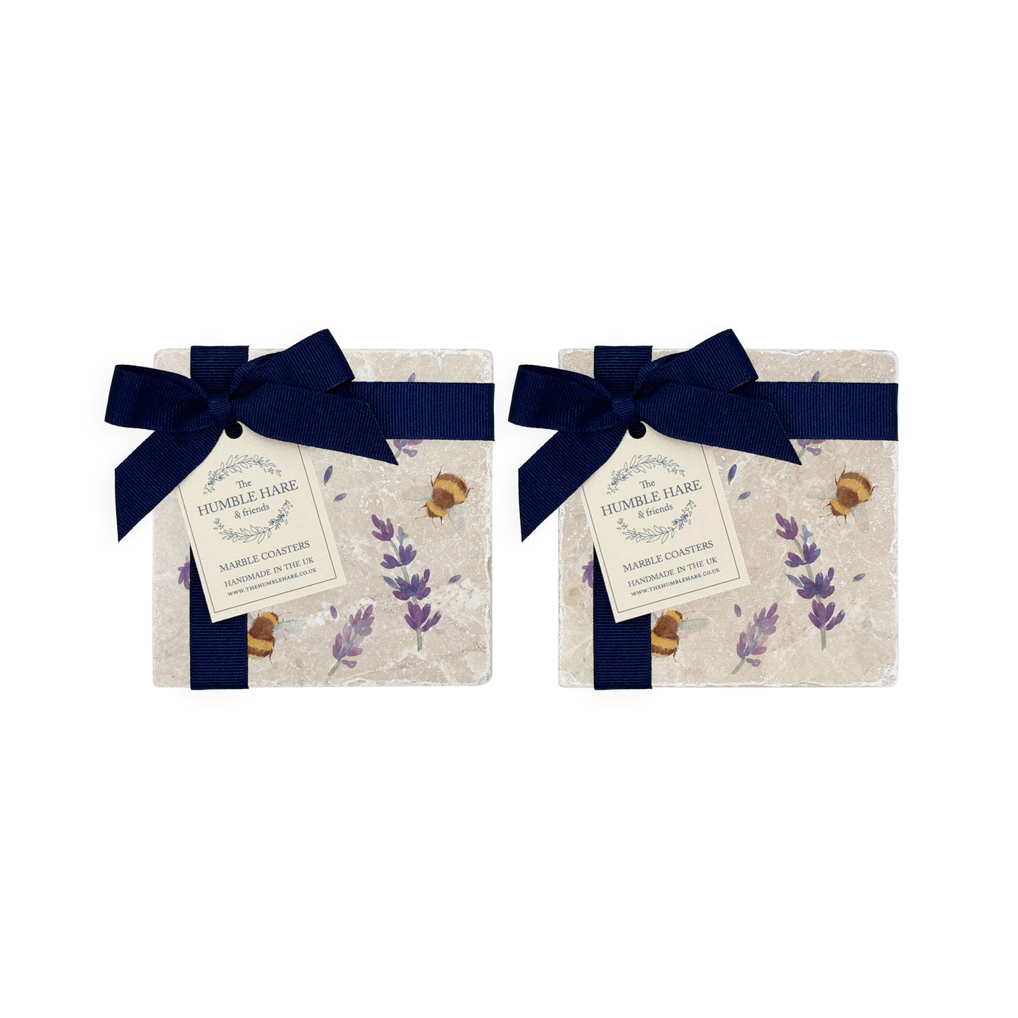 A set of 4 handmade marble coasters featuring a watercolour bee and lavender design, packaged in 2 pairs, with a luxurious blue bow and gift tag.