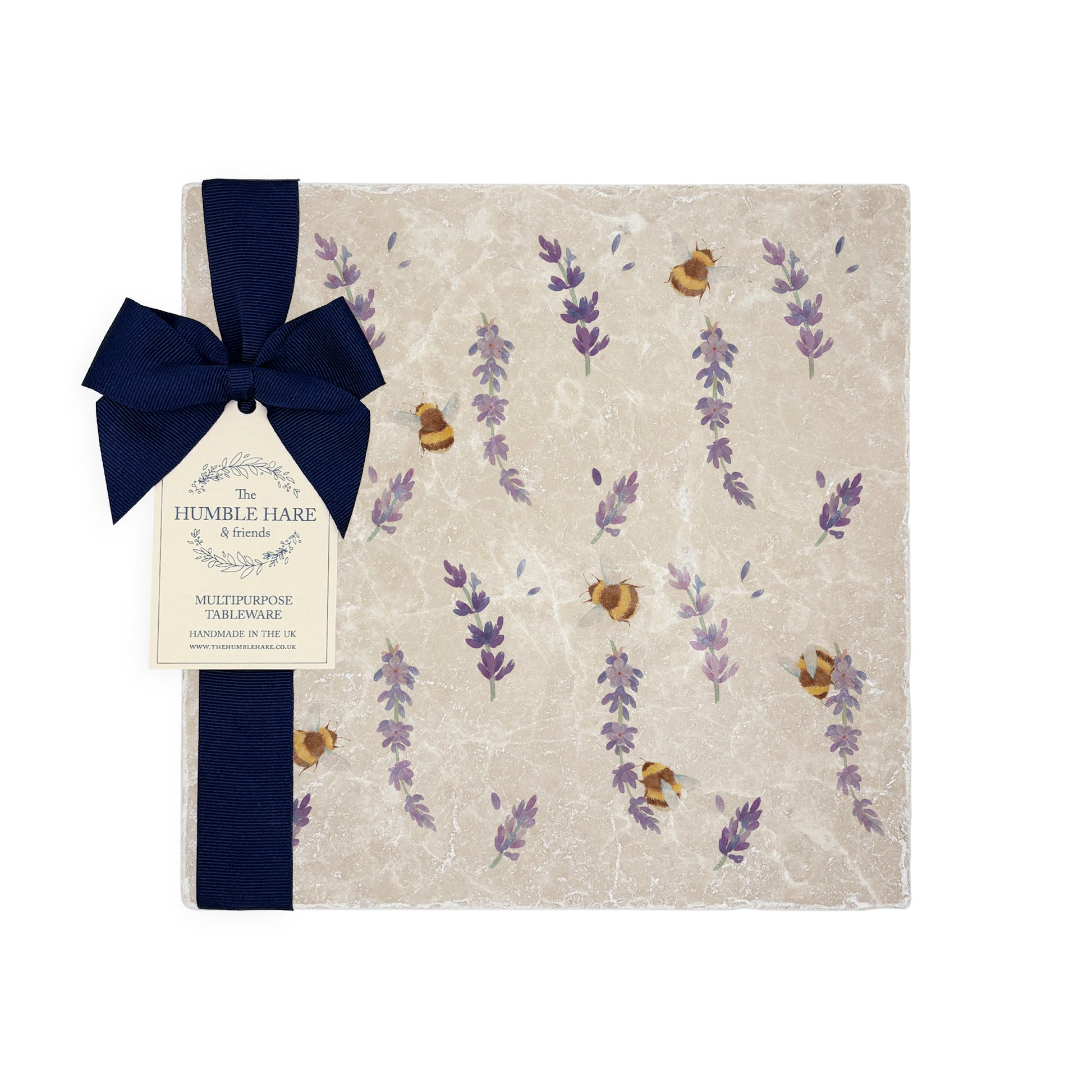 A handmade medium marble platter with a watercolour lavender and bee pattern, packaged with a luxurious dark blue bow and branded gift tag.